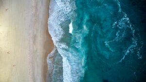 aerial view of beach and ocean waves